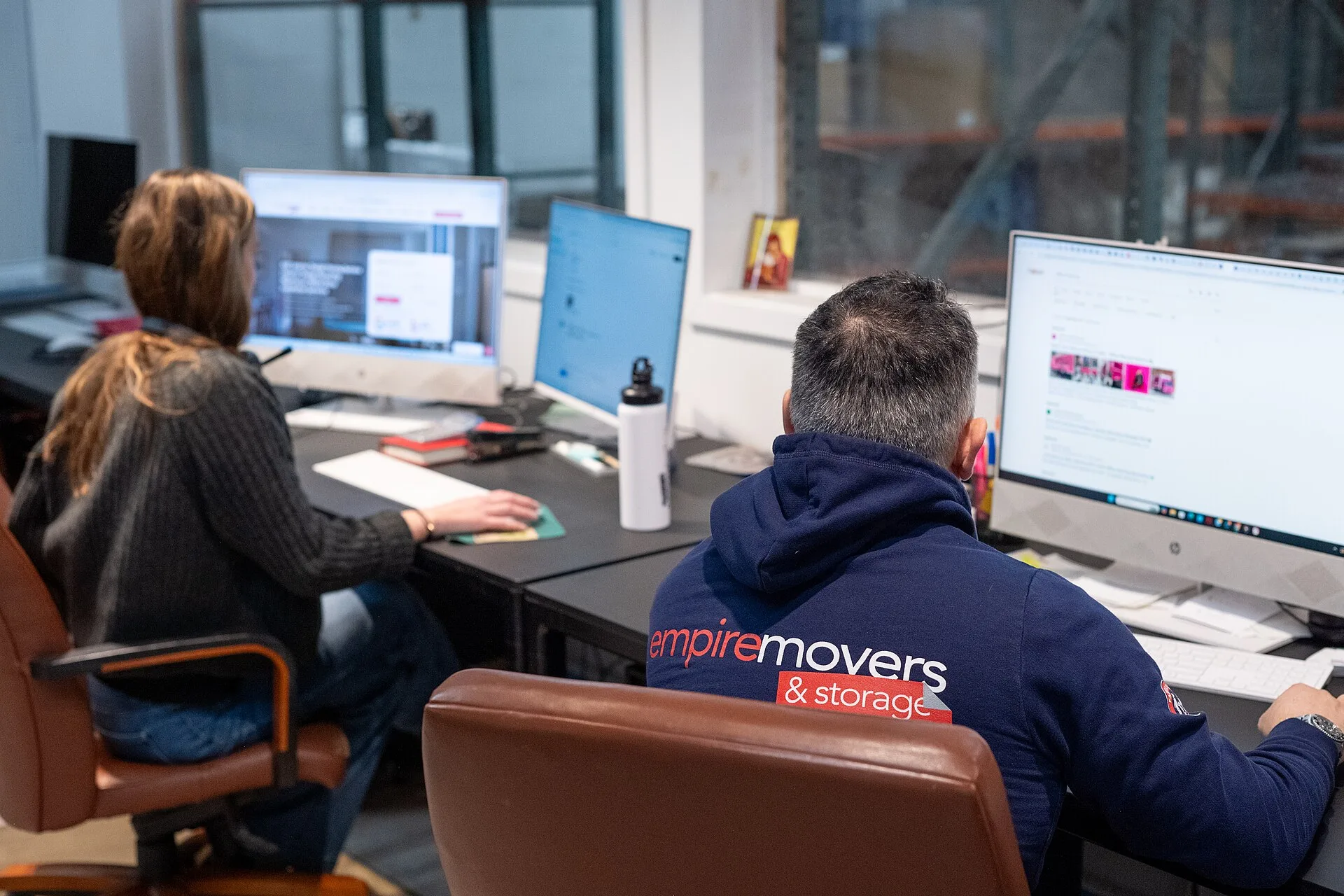 Empire Movers and Storage`s office in NYC. All the workers are on their calls with the clients. How a self-storage business hires people it can count on without the jargon