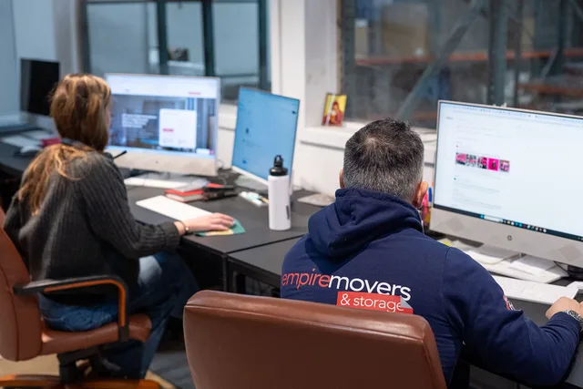 Empire Movers and Storage`s office in NYC. All the workers are on their calls with the clients. How a self-storage business hires people it can count on without the jargon